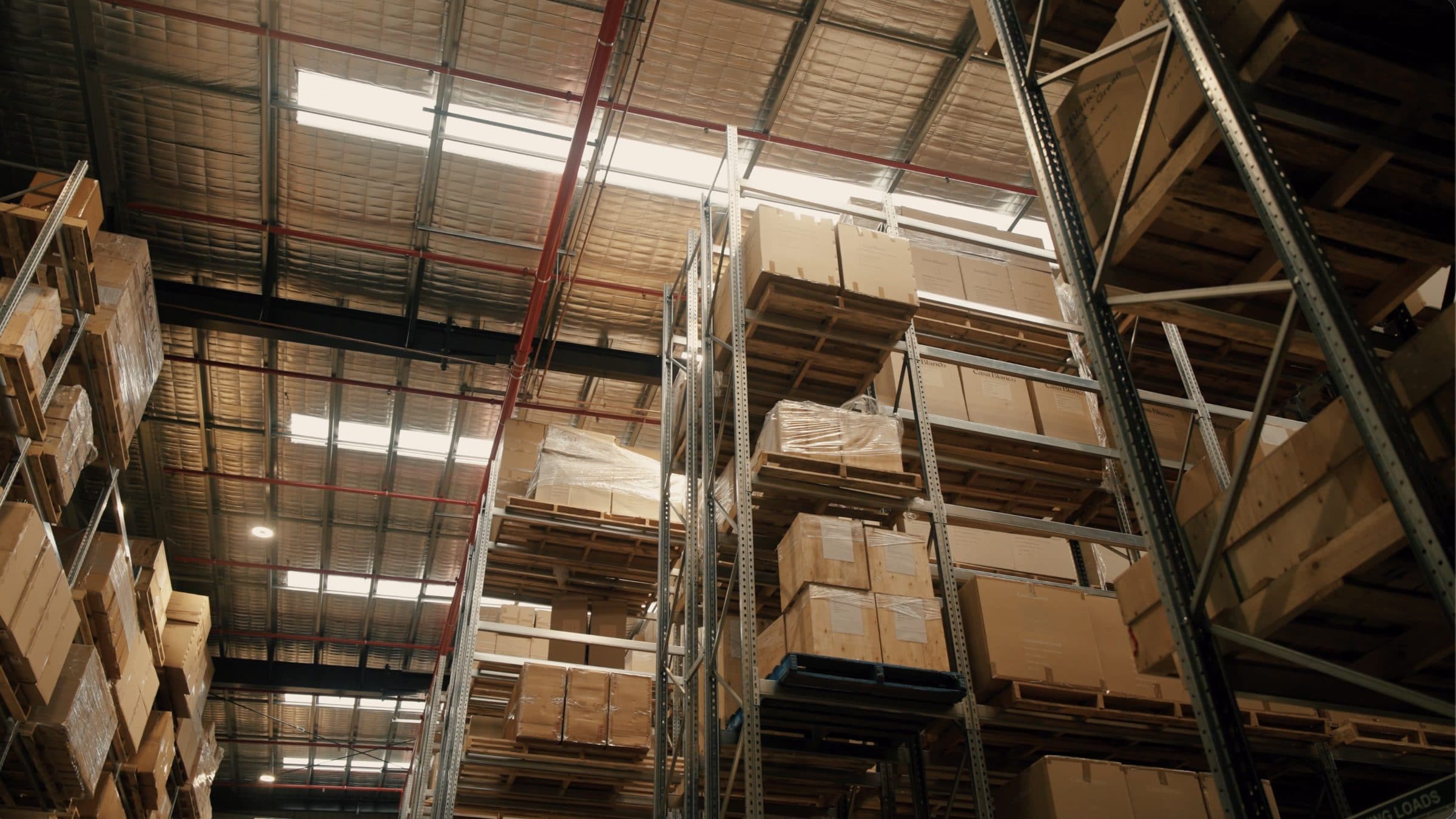 Crated high-value stock held on racking in the monitored facility.